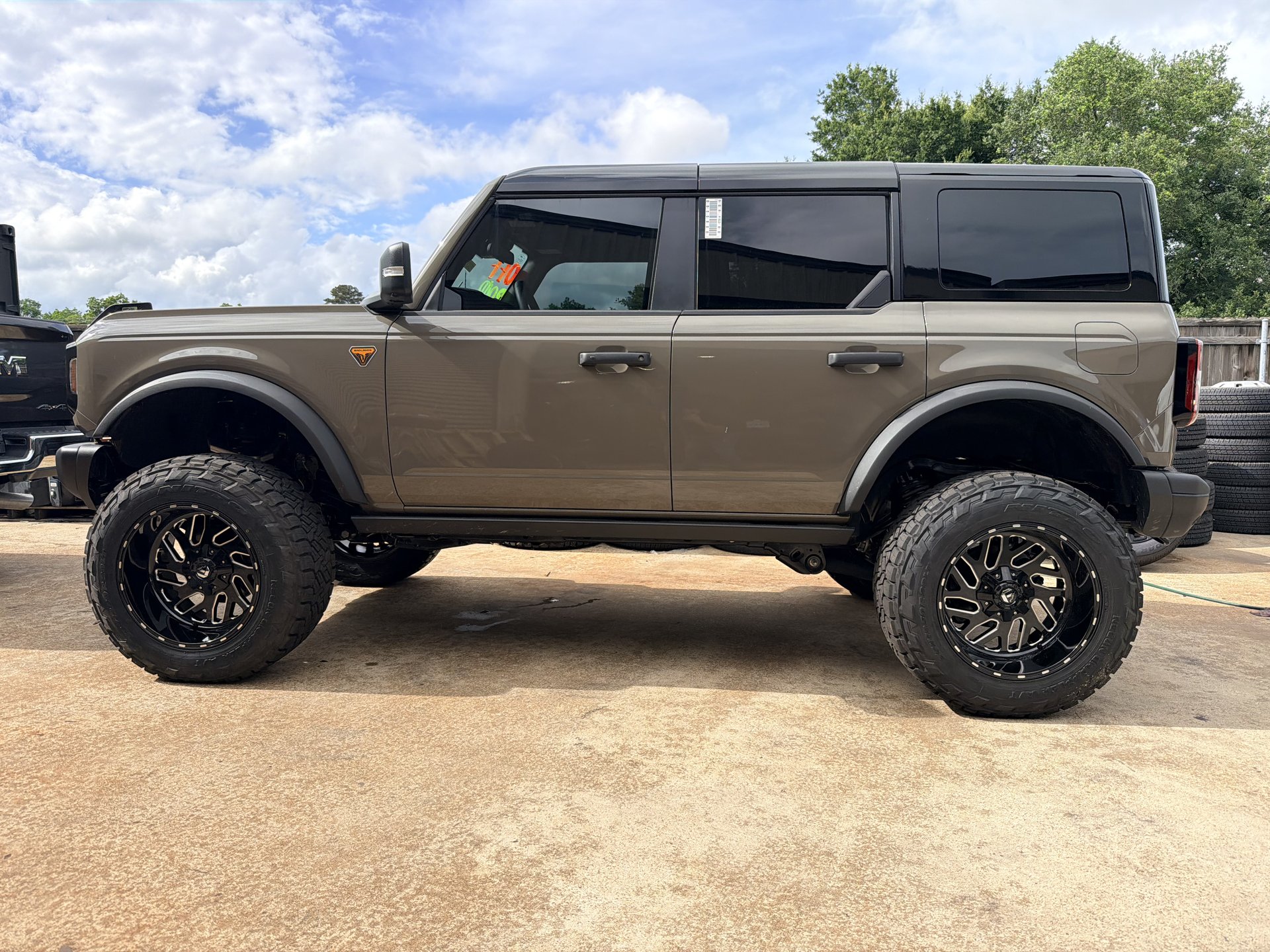 Tan Ford Bronco with lift kit and aggressive off-road tires, Level Up Customs, Alvin TX