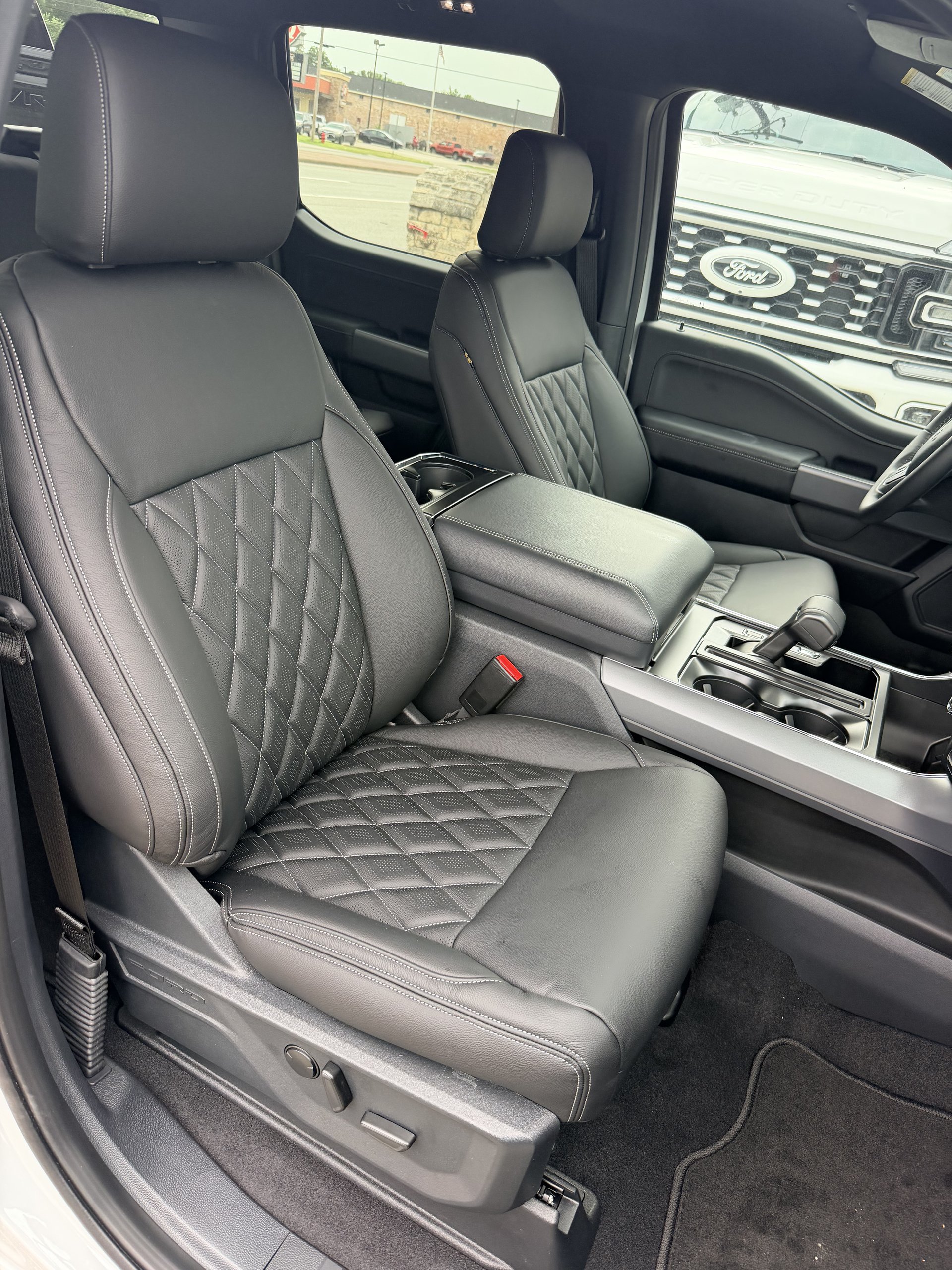 Ford F-150 with black diamond-stitch leather front seats, Level Up Customs, Alvin TX